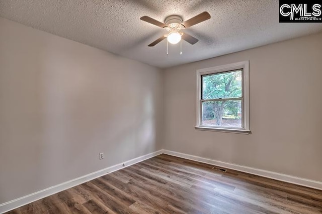 2230 Corning Rd, Columbia, SC 29205 - unfurnished room featuring dark wood-type flooring, baseboards, a textured ceiling, and a ceiling fan