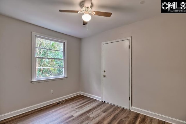 2230 Corning Rd, Columbia, SC 29205 - spare room with wood finished floors, a ceiling fan, and baseboards