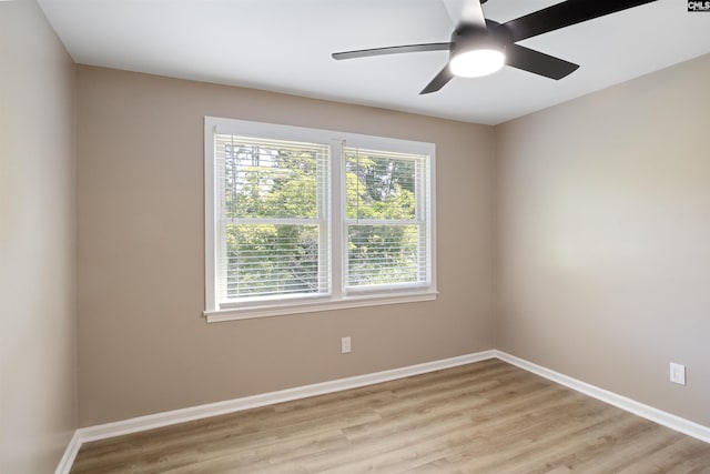 unfurnished room featuring ceiling fan and light hardwood / wood-style flooring