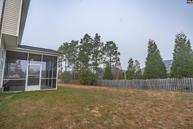 view of yard with a sunroom