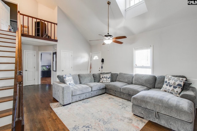 living room featuring high vaulted ceiling, ceiling fan, and dark hardwood / wood-style floors