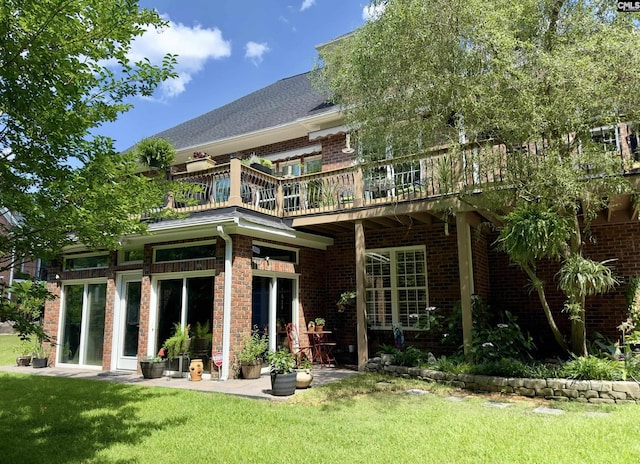 345 Old Wood Dr, Columbia, SC 29212 - back of property featuring a lawn, brick siding, and a wooden deck
