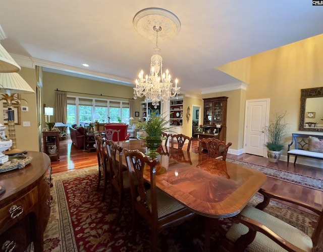 345 Old Wood Dr, Columbia, SC 29212 - dining room with a chandelier, wood finished floors, ornamental molding, and baseboards