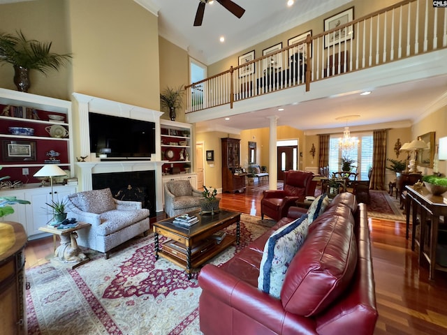 345 Old Wood Dr, Columbia, SC 29212 - living room featuring ceiling fan, wood finished floors, a high ceiling, ornamental molding, and a chandelier