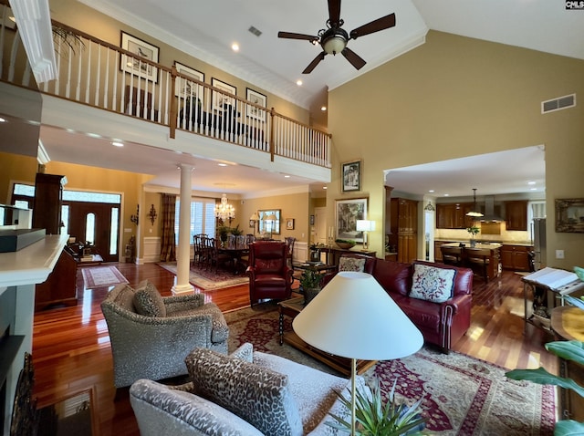 345 Old Wood Dr, Columbia, SC 29212 - living area featuring high vaulted ceiling, wood finished floors, ceiling fan, ornate columns, and crown molding