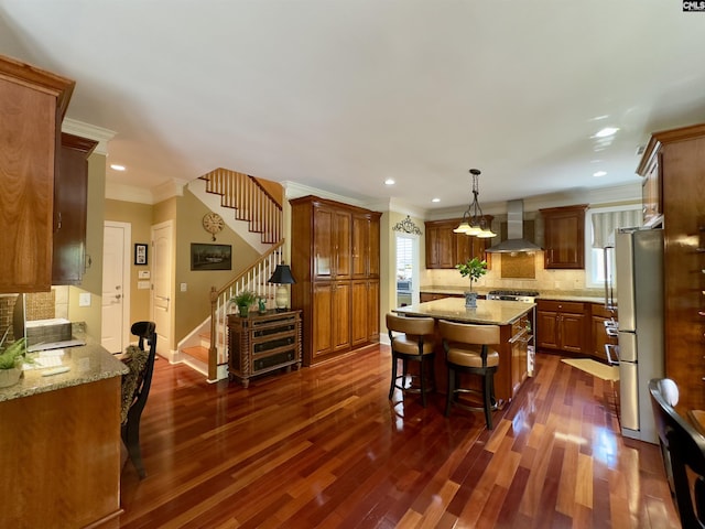 345 Old Wood Dr, Columbia, SC 29212 - kitchen with wall chimney exhaust hood, appliances with stainless steel finishes, ornamental molding, decorative backsplash, and dark wood-style flooring