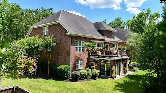 back of house with a lawn