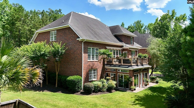 345 Old Wood Dr, Columbia, SC 29212 - rear view of house with a yard, brick siding, a deck, and a shingled roof