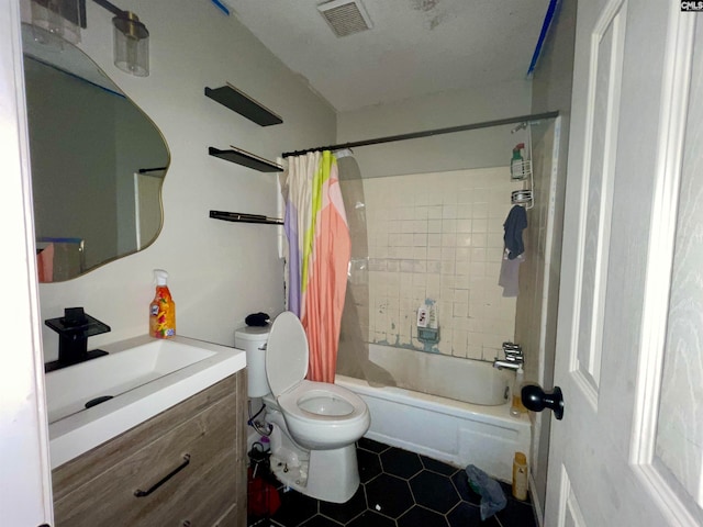 full bathroom featuring toilet, vanity, tile patterned flooring, and shower / bath combo with shower curtain