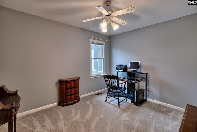 carpeted office with ceiling fan