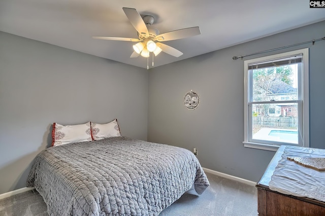 bedroom with ceiling fan and carpet floors