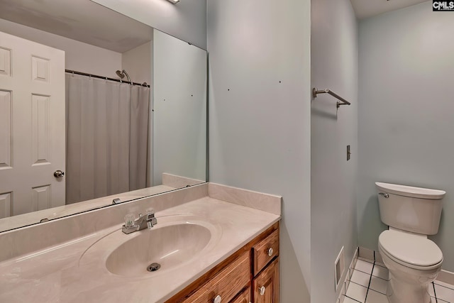 bathroom featuring toilet, vanity, tile patterned floors, and curtained shower