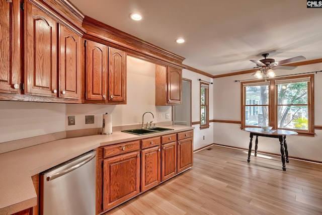 kitchen with sink, ceiling fan, stainless steel dishwasher, crown molding, and light wood-type flooring