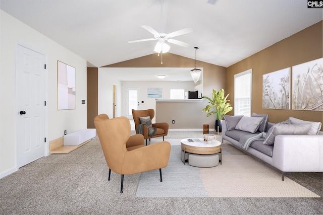 living room featuring lofted ceiling, carpet, and ceiling fan