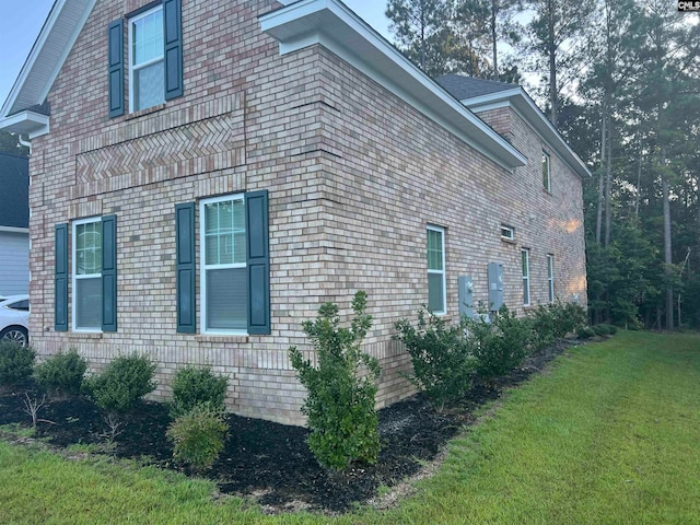 view of property exterior featuring a lawn