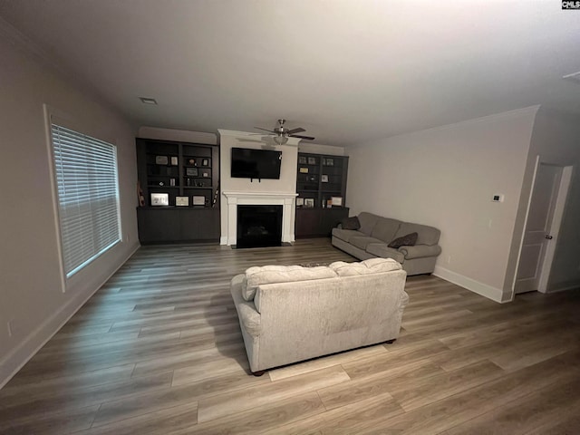 living room with hardwood / wood-style floors and ceiling fan