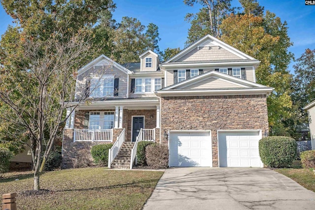 view of front of home featuring a garage, a porch, and a front lawn