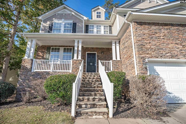 view of front facade with a garage and covered porch