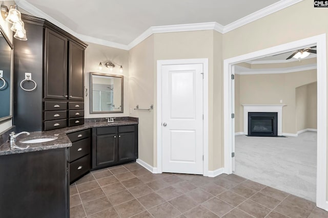 bathroom with ceiling fan, vanity, tile patterned flooring, and ornamental molding