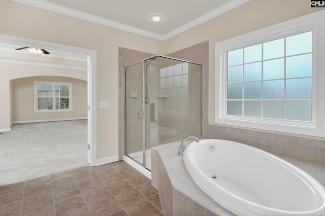 bathroom with plus walk in shower, tile patterned flooring, ceiling fan, and crown molding