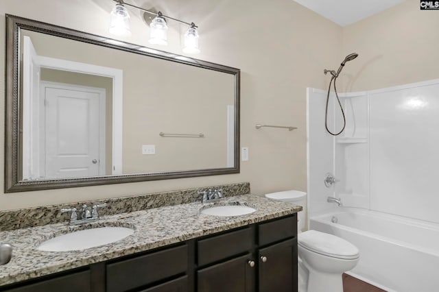 full bathroom featuring shower / tub combination, vanity, and toilet