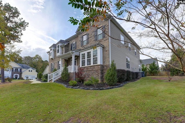 view of front of home with a garage and a front yard