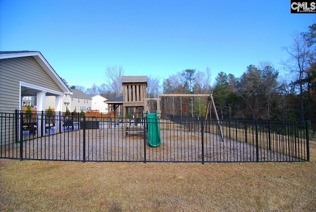 view of jungle gym featuring a lawn