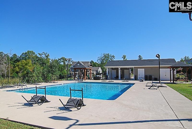 view of swimming pool featuring a patio