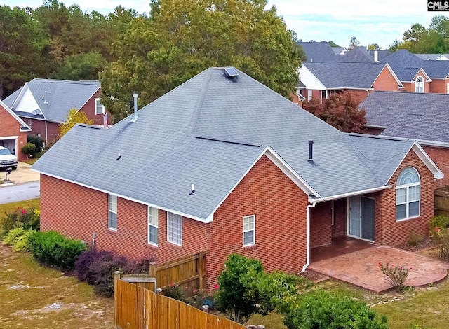 rear view of property featuring a patio area