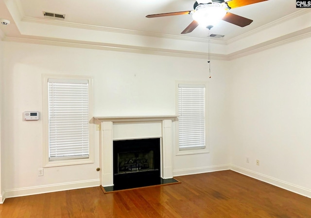 unfurnished living room featuring ornamental molding, dark hardwood / wood-style flooring, and ceiling fan