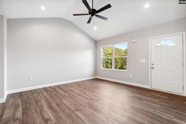 foyer entrance featuring ceiling fan, dark hardwood / wood-style flooring, and vaulted ceiling