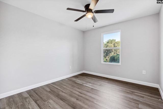 unfurnished room featuring ceiling fan and hardwood / wood-style floors