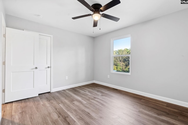 unfurnished bedroom featuring light hardwood / wood-style floors and ceiling fan