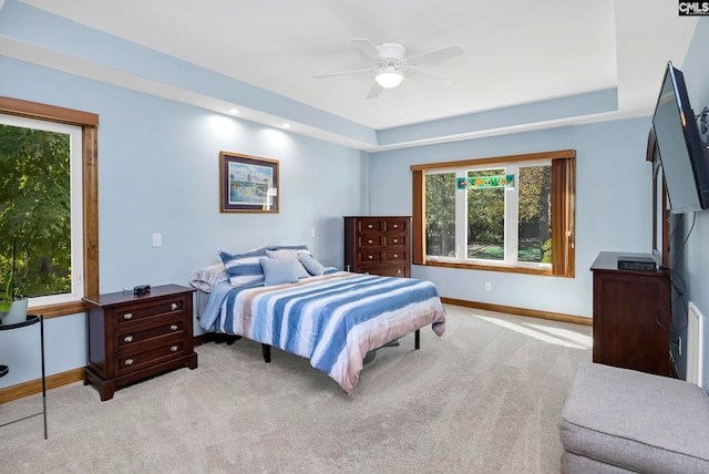 bedroom featuring light carpet and ceiling fan