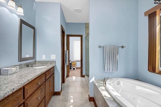 bathroom featuring tile patterned flooring, vanity, and independent shower and bath