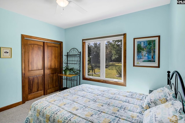 bedroom with carpet flooring, ceiling fan, and a closet