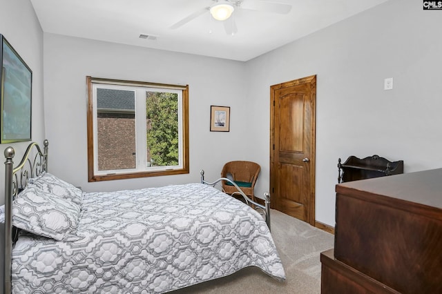 bedroom with ceiling fan and carpet