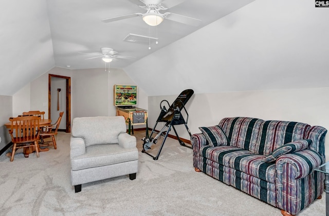 living area featuring lofted ceiling and light carpet