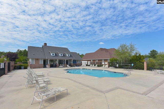 view of swimming pool featuring a patio area