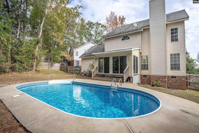 view of swimming pool with a patio