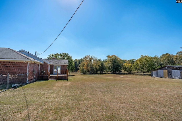 view of yard with a wooden deck