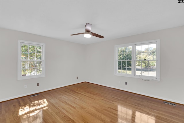 unfurnished room with ceiling fan and light hardwood / wood-style flooring