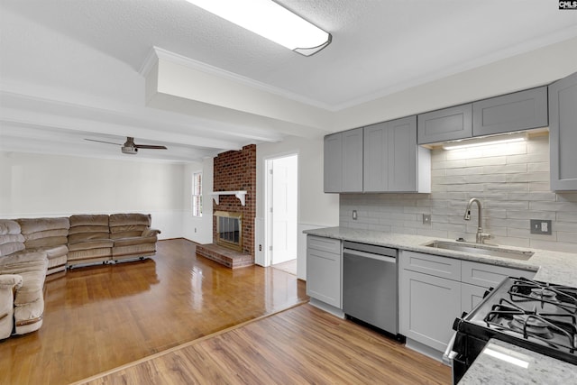 kitchen with sink, black stove, decorative backsplash, and dishwasher