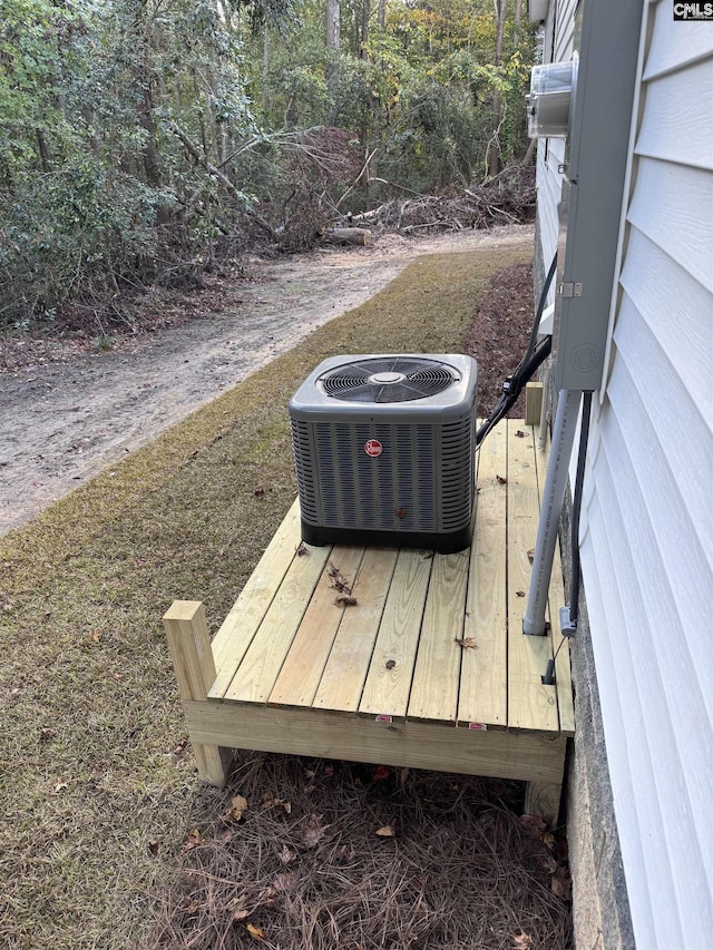 wooden deck with central air condition unit