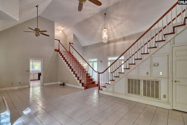 115 Cedar Lake Rd, Blythewood, SC 29016 - foyer entrance featuring a ceiling fan, stairway, light tile patterned floors, high vaulted ceiling, and baseboards