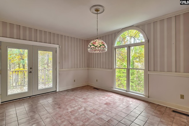 115 Cedar Lake Rd, Blythewood, SC 29016 - unfurnished dining area with french doors, plenty of natural light, baseboards, crown molding, and wallpapered walls