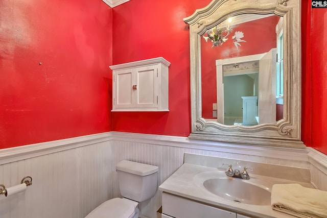 115 Cedar Lake Rd, Blythewood, SC 29016 - half bathroom with a wainscoted wall, toilet, and vanity