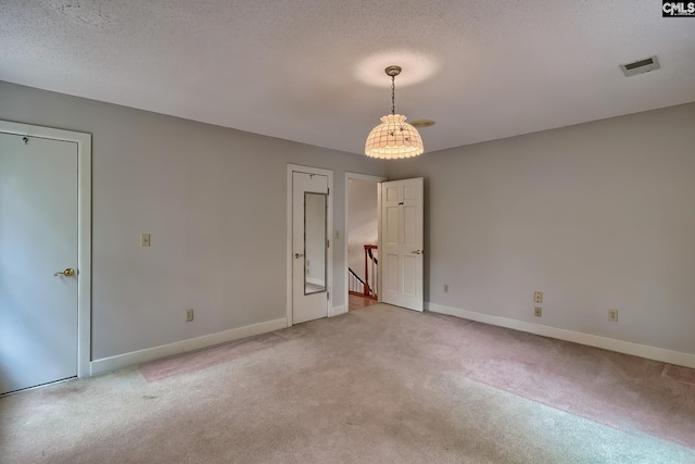 115 Cedar Lake Rd, Blythewood, SC 29016 - unfurnished bedroom with light carpet, baseboards, and a textured ceiling