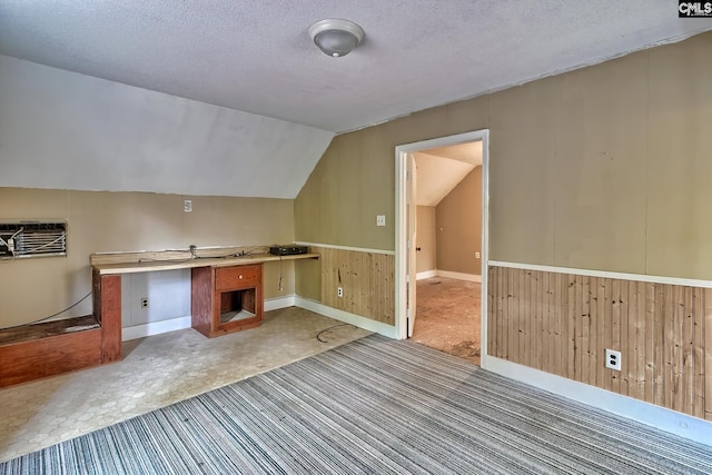 115 Cedar Lake Rd, Blythewood, SC 29016 - unfurnished office with wooden walls, vaulted ceiling, a textured ceiling, and a wall mounted air conditioner