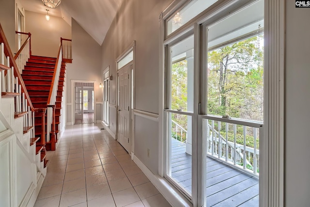 115 Cedar Lake Rd, Blythewood, SC 29016 - entryway featuring stairs, light tile patterned floors, healthy amount of natural light, and high vaulted ceiling